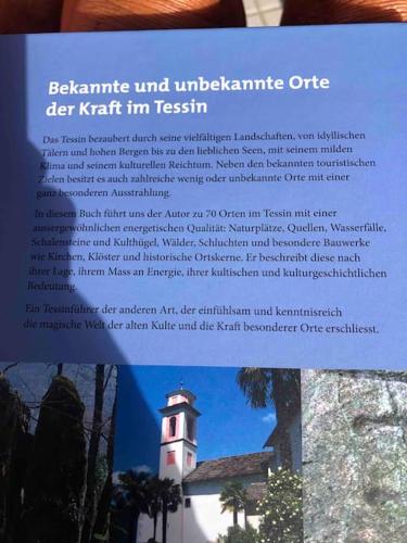 a page of a book with a picture of a lighthouse at Rustico Gin Avegno Torbecc, Vallemaggia, Tessin, in Gordevio