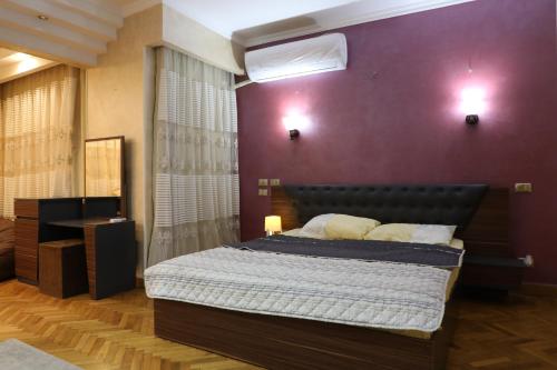 Postel nebo postele na pokoji v ubytování Villa Nasr city