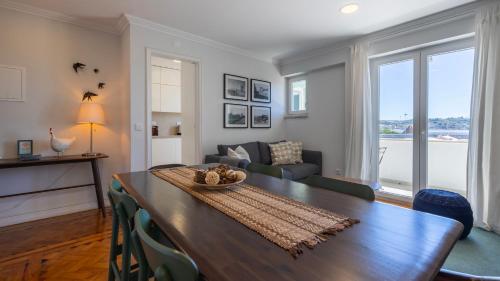 a living room with a table and a couch at Charming Belém 3BDR Property by LovelyStay in Lisbon