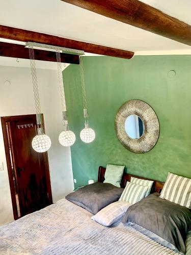 a bedroom with two beds and a mirror at Aschenputtel Relax Bernsteinsee Stüde in Sassenburg