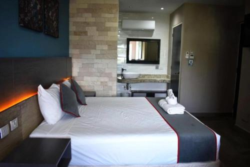 Katil atau katil-katil dalam bilik di Illusion Xpress I Attraction Hotel Deluxe