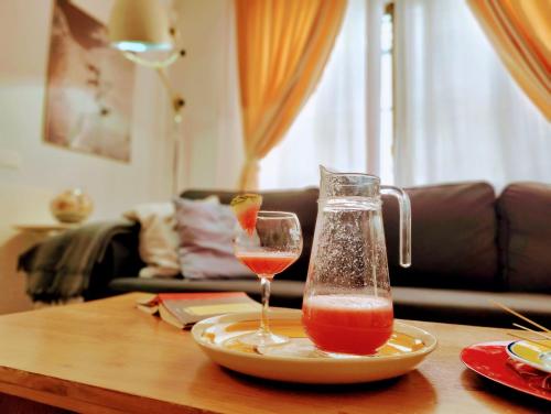 a table with two glasses of wine on a table at Villa Yandre Garden House - Ayamonte in Ayamonte