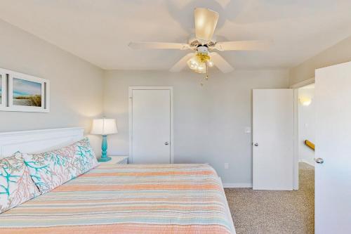 a bedroom with a bed and a ceiling fan at Snapper #18B-CAC in Buxton