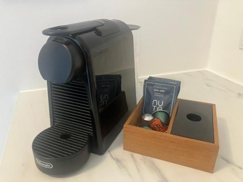 a coffee maker and a box on a counter at Krogsgaarden B&B in Nibe