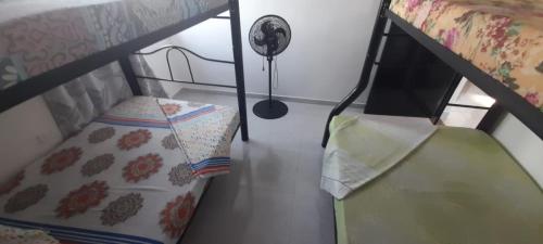 a room with a bunk bed and a pillow at J79 Apartamentos - Cerca al Parque Deportivo -Pista BMX- Pista Patinaje Velocidad - Coliseo Mayor - Complejo Acuático - Estadio Alterno in Ibagué