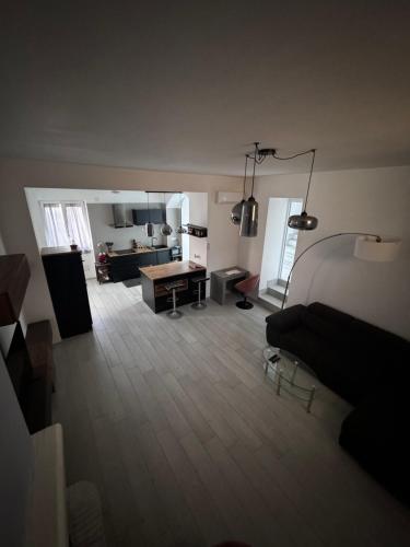 a living room with a couch and a kitchen at Casa Vacanze Aurelia in Procida