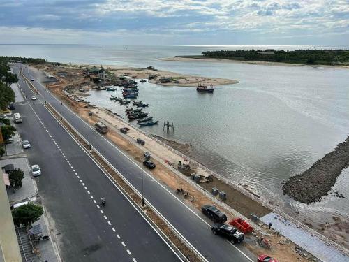 an aerial view of a highway next to a body of water at Pi House Homestay in Dong Hoi