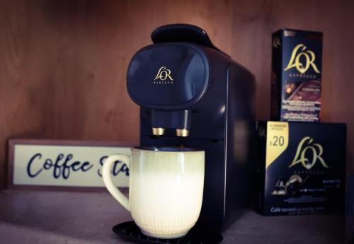 a coffee maker is making a cup of coffee at Lough View in Belcoo