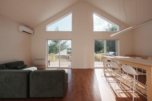 a living room with a couch and a table at Chalet 3 OST Shefford in Shefford