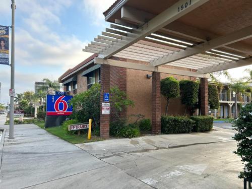 a gas station with a sign in front of it at Studio 6 Suites Santa Ana, CA in Santa Ana