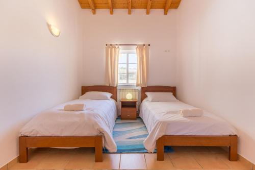 Postel nebo postele na pokoji v ubytování Vila Fantastica