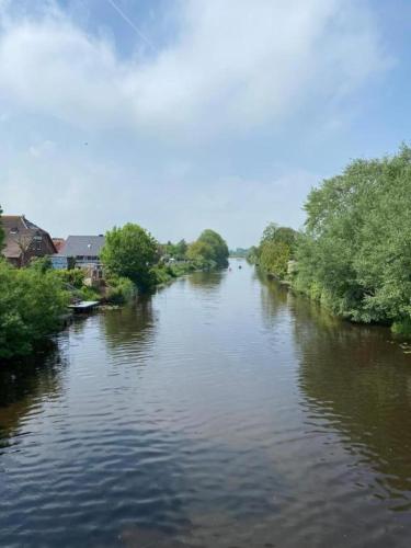a view of a river from a bridge at Ferienwohnung Tee Tied in Dornumersiel