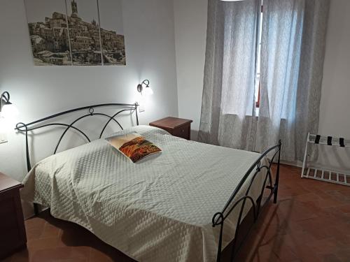 Ένα ή περισσότερα κρεβάτια σε δωμάτιο στο Margherita