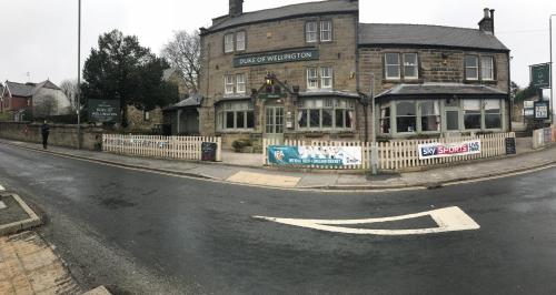 a building on the corner of a street at Duke Of Wellington in Matlock