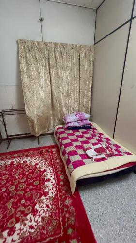ALIFUMAI HOMESTAY GUAR CHEMPEDAK YAN KEDAH客房内的一张或多张床位