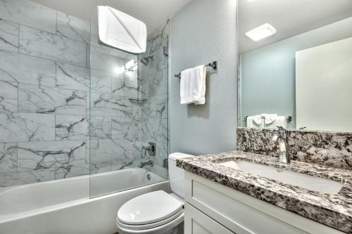a bathroom with a sink and a toilet and a shower at Luxe11 blue diamond VIP mega lodge lake tahoe in Stateline