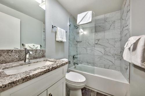a bathroom with a sink and a toilet and a shower at Luxe11 blue diamond VIP mega lodge lake tahoe in Stateline