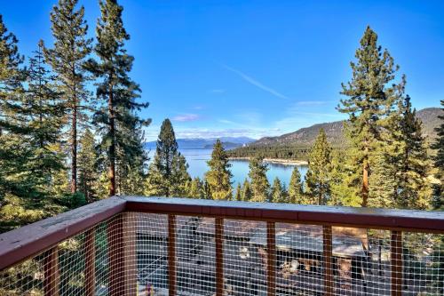 a balcony with a view of a lake and trees at LX07 Skyfall lakeview house with dry sauna close to Edgewood in Zephyr Cove
