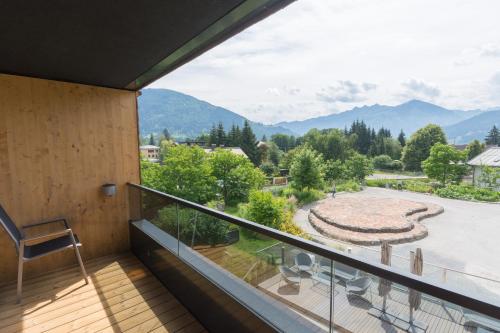 a balcony with a view of the mountains at Schönblick Residence Apartments - including summer & mobility card in Zell am See