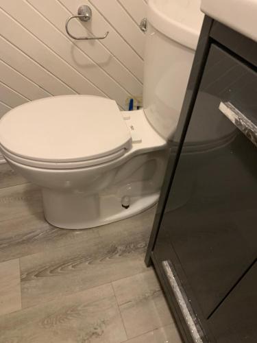a bathroom with a white toilet and a sink at Ottawa Heritage Private Rooms Across OttawaU Not Entire Apt in Ottawa