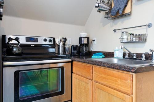 a kitchen with a sink and a stove at #StayInMyDistrict Hyde Park Studio Up in Boise