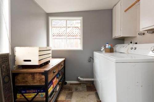 a kitchen with a washing machine and a window at #StayInMyDistrict Hyde Park Studio Up in Boise