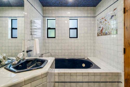 a bathroom with a tub and a sink at LX33 Lake Tahoe Villa with Gameroom Hot tub Sauna in Zephyr Cove