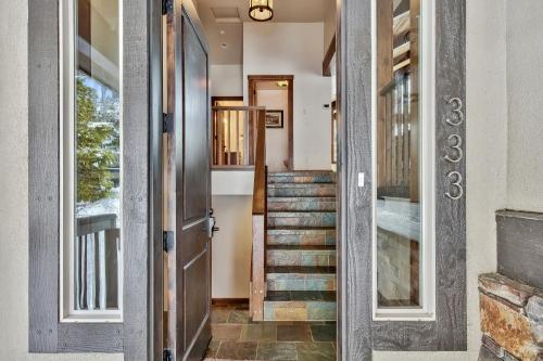 a hallway of a house with a door and stairs at LX33 Lake Tahoe Villa with Gameroom Hot tub Sauna in Zephyr Cove