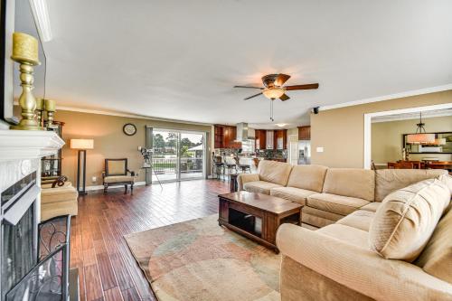 a living room with a couch and a fireplace at Luxe Lakefront Portsmouth Home Fish, Swim and Play! in Portsmouth