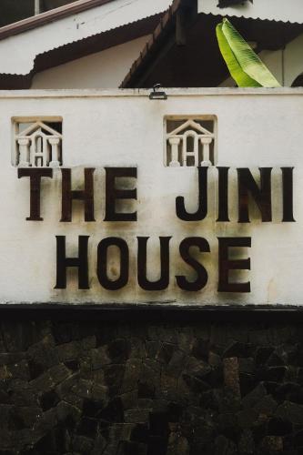 a sign for the inn house on the side of a building at The Jini House in Ahangama