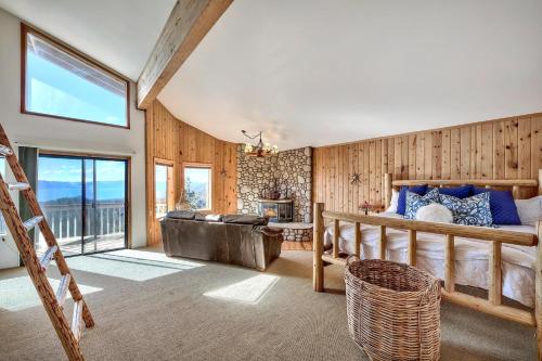 a bedroom with a bed and a couch at Mv15 lakeview top of the mountain townhome in Stateline
