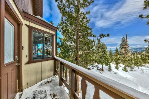 a winter view from the balcony of a house at Mv17 amazing lake view spacious ski cabin in Stateline