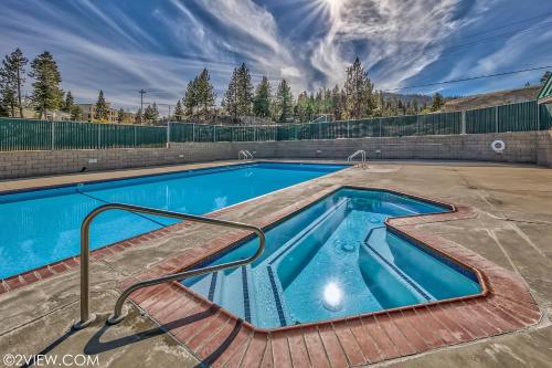 a swimming pool with a ramp around it at Mv17 amazing lake view spacious ski cabin in Stateline