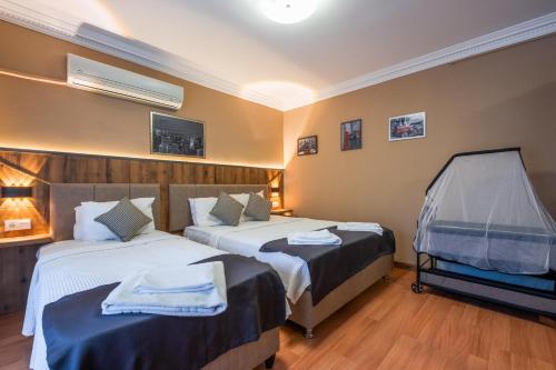 Postel nebo postele na pokoji v ubytování Platanus Hotel Altınoluk