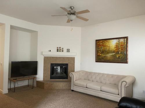 a living room with a couch and a fireplace at Comfort and Style Queen bedroom in Vacaville