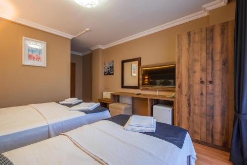 Postel nebo postele na pokoji v ubytování Platanus Hotel Altınoluk