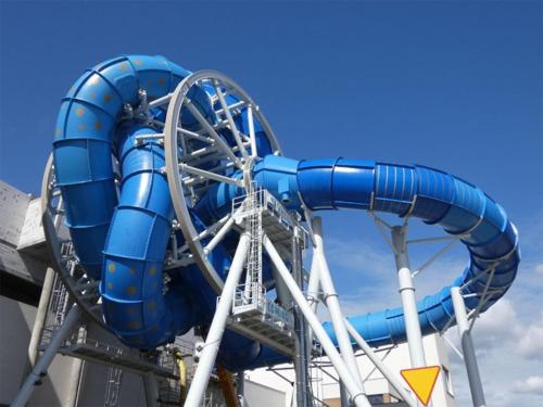 a blue water slide on a roller coaster at Apartament Joanna in Reda
