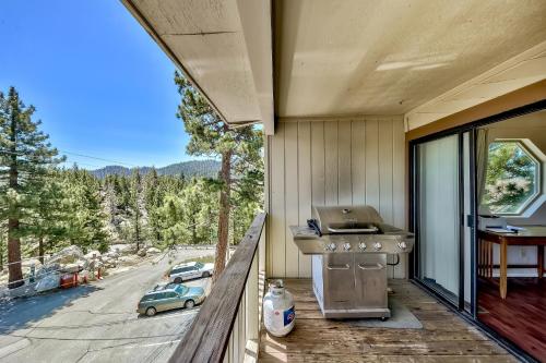 a balcony with a grill and a view of a street at MV55 Lakeview townhome on the Ridge with Hot tub in Stateline
