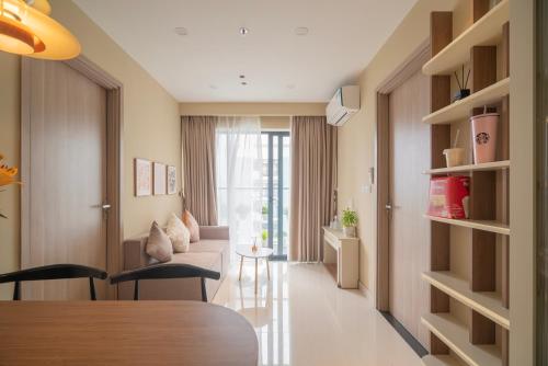 a living room with a couch and a table at Homestay Huế ơi 2 in Thôn Văn Dương