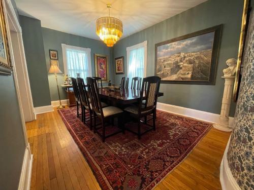 a dining room with a table and chairs at Beacon Hermitage in Beacon