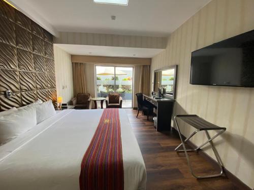 Voodi või voodid majutusasutuse Luxury Inkari Hotel toas