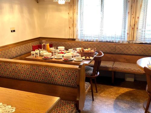 a table with food on it in a restaurant at Stöcklhof in Dienten am Hochkönig