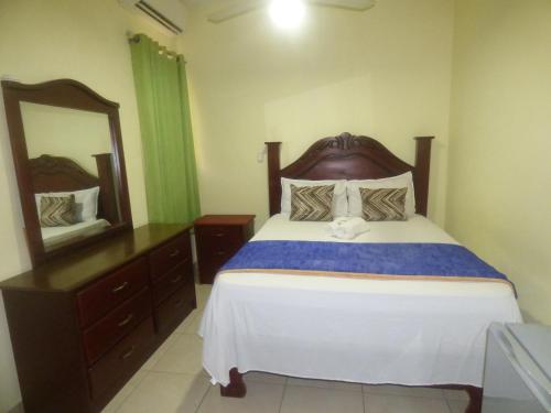 Ένα ή περισσότερα κρεβάτια σε δωμάτιο στο Hotel Enrique I Gazcue, Bed and Breakfast