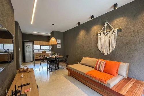 a living room with a couch and a table at Villa Kamby Milagres B003 in São Miguel dos Milagres