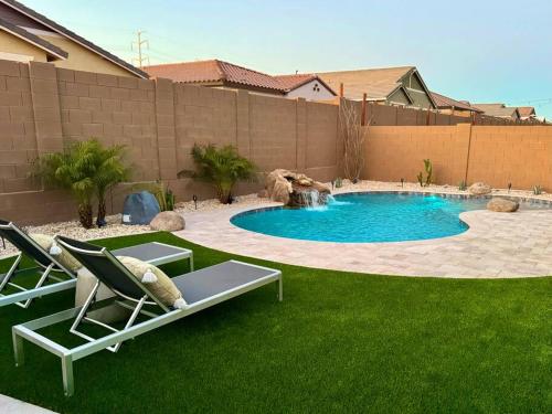a swimming pool with two lounge chairs in a yard at Private Pool! Avondale - Modern Mtn View Oasis in Cashion