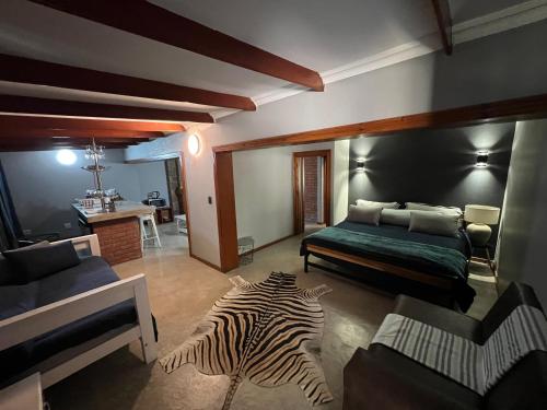 Una cama o camas en una habitación de Nectar Game Lodge