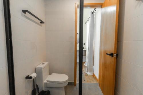 a bathroom with a toilet and a shower at S Boutique Hotel in Bocas del Toro