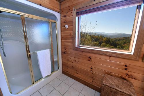 a bathroom with a shower and a large window at Dream Catcher- Blue Ridge GA in Blue Ridge