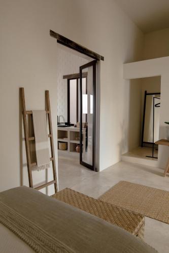 Ένα ή περισσότερα κρεβάτια σε δωμάτιο στο Narrativ Lofts