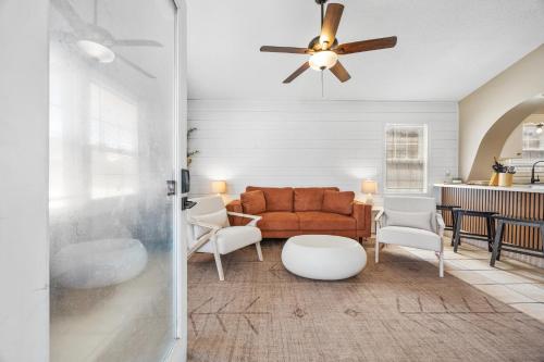 a living room with a couch and a ceiling fan at Feel at Home a 3 Minute Walk from the Beach in Myrtle Beach